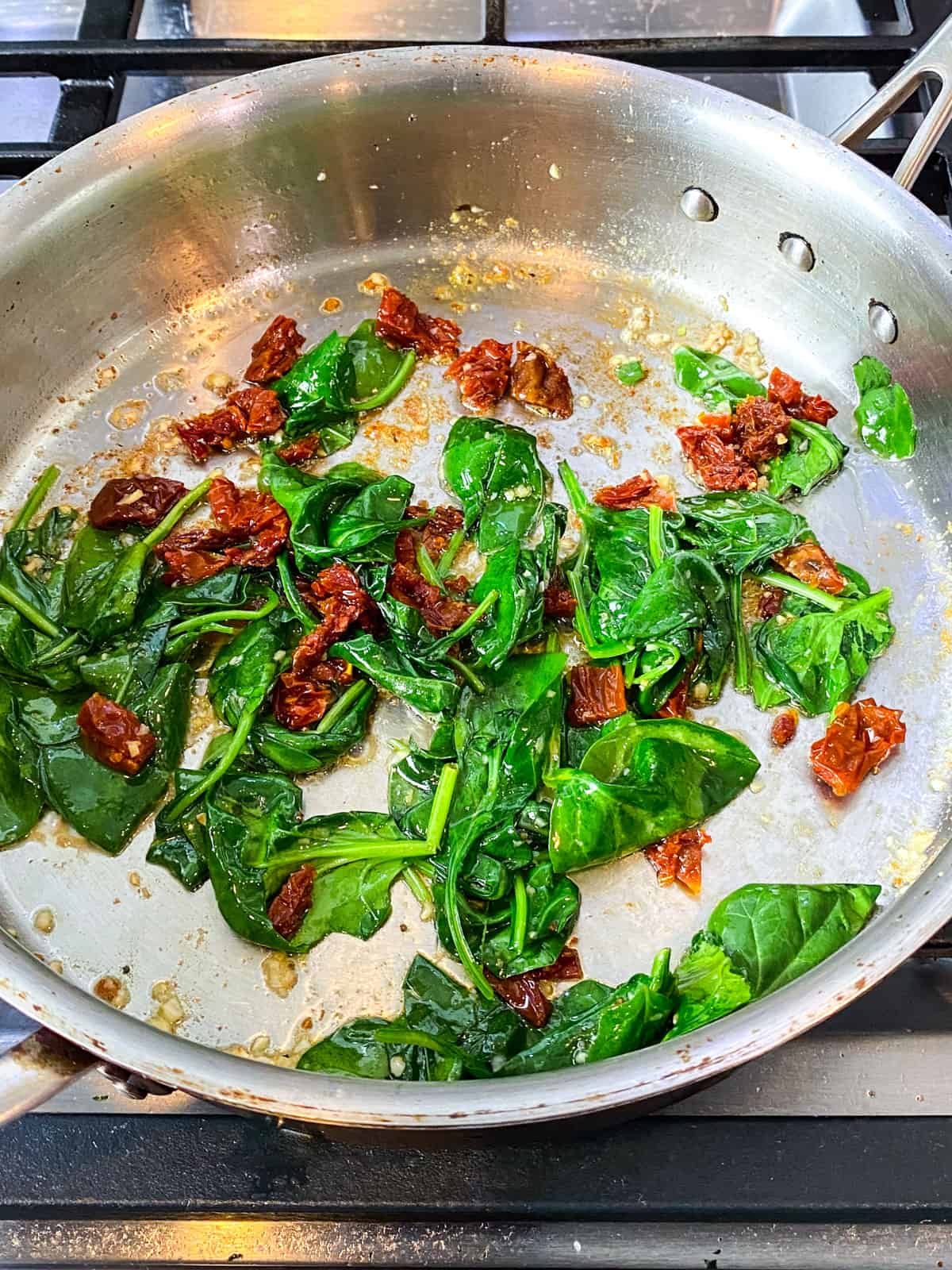 Add the fresh spinach and saute with the sun dried tomatoes.