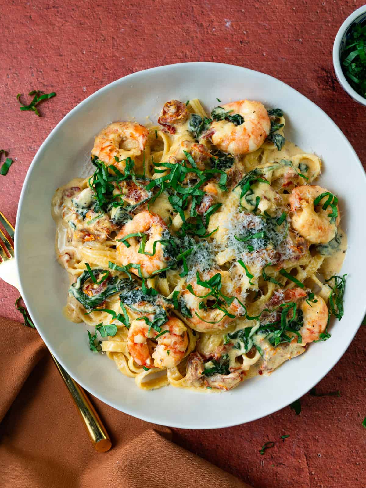 Tuscan shrimp pasta with sundried tomatoes and spinach.