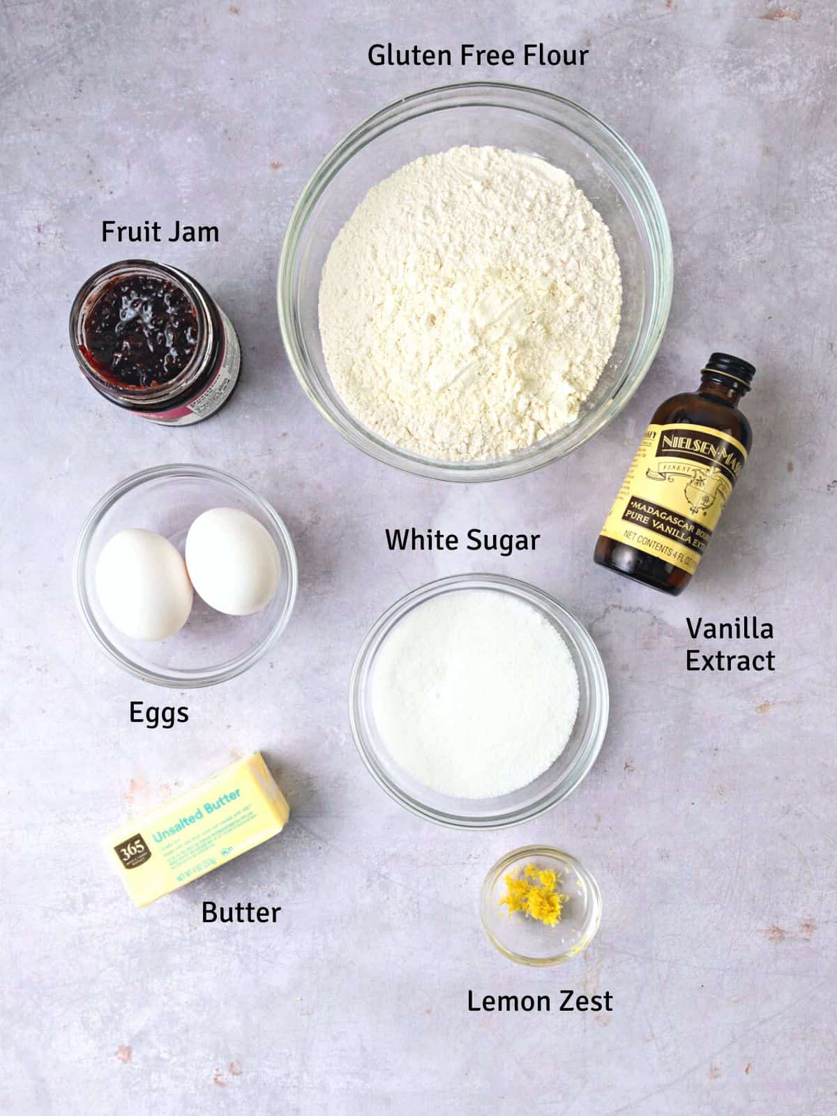 Ingredients for gluten free hamantaschen cookies, including butter, gluten free flour, vanilla and eggs.