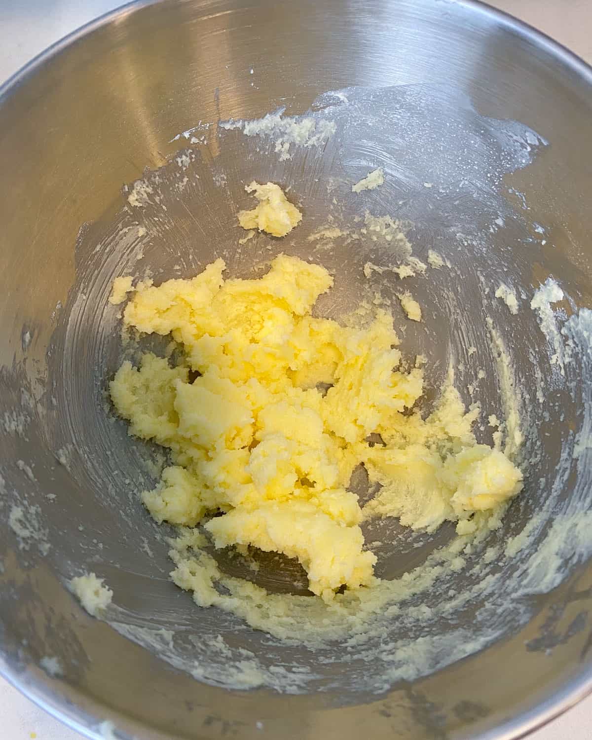 Using an electric mixer, mix the softened butter and sugar until well combined.