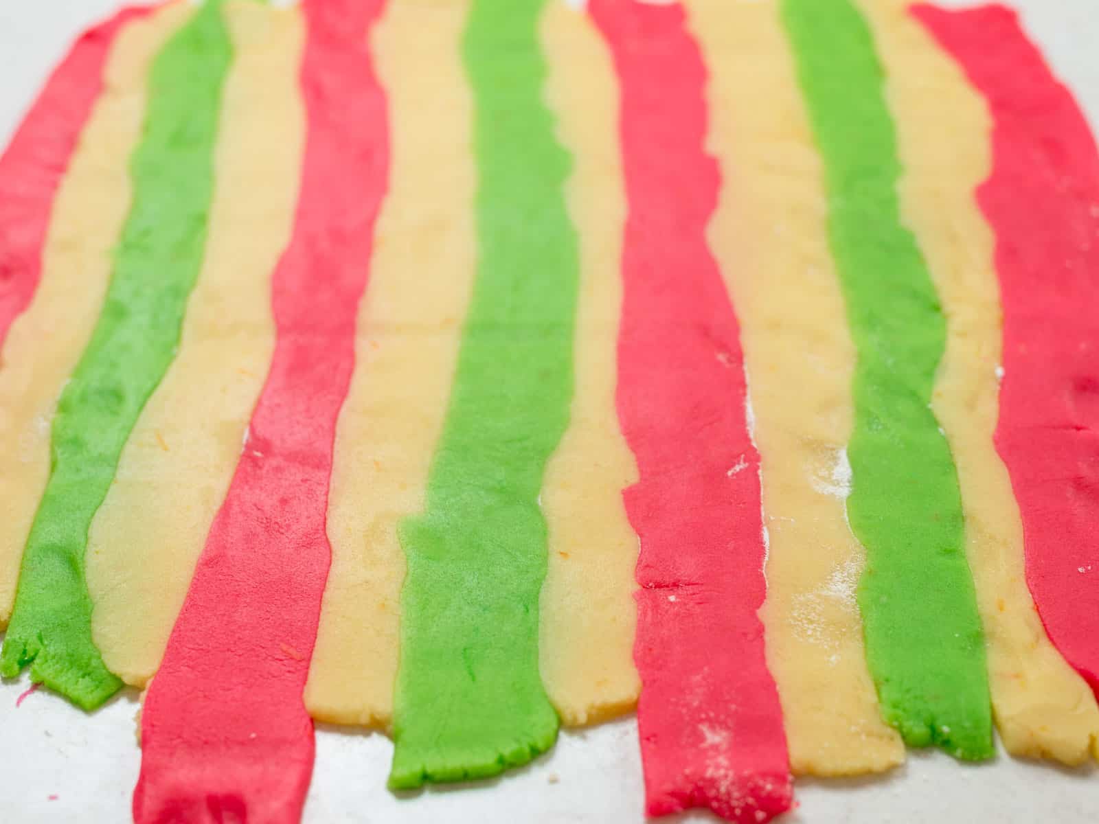 Roll out the rainbow hamantaschen dough to ¼ inch thickness.