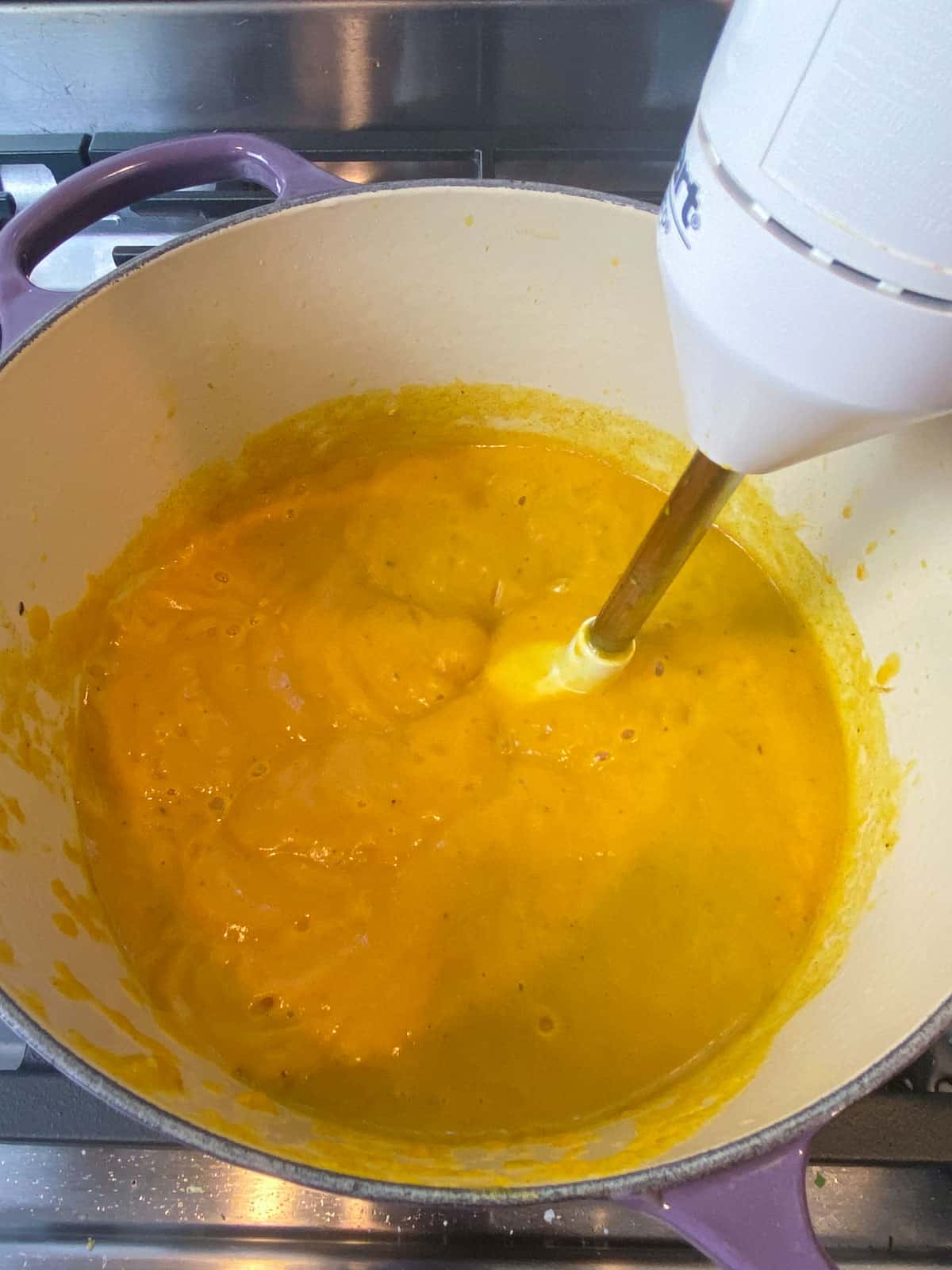 Blend the squash soup with an immersion blender until completely smooth.