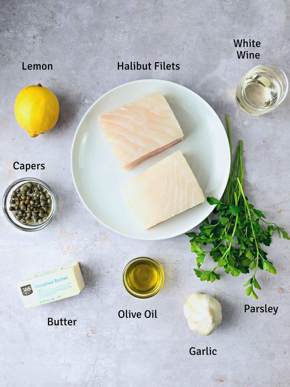 Ingredients for halibut piccata, including lemon, white wine and capers.