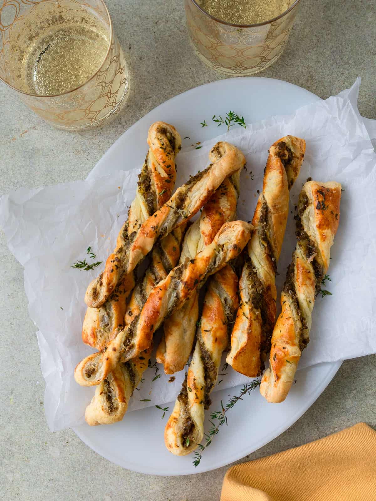 Savory cheese puff pastry straws with olive tapenade.