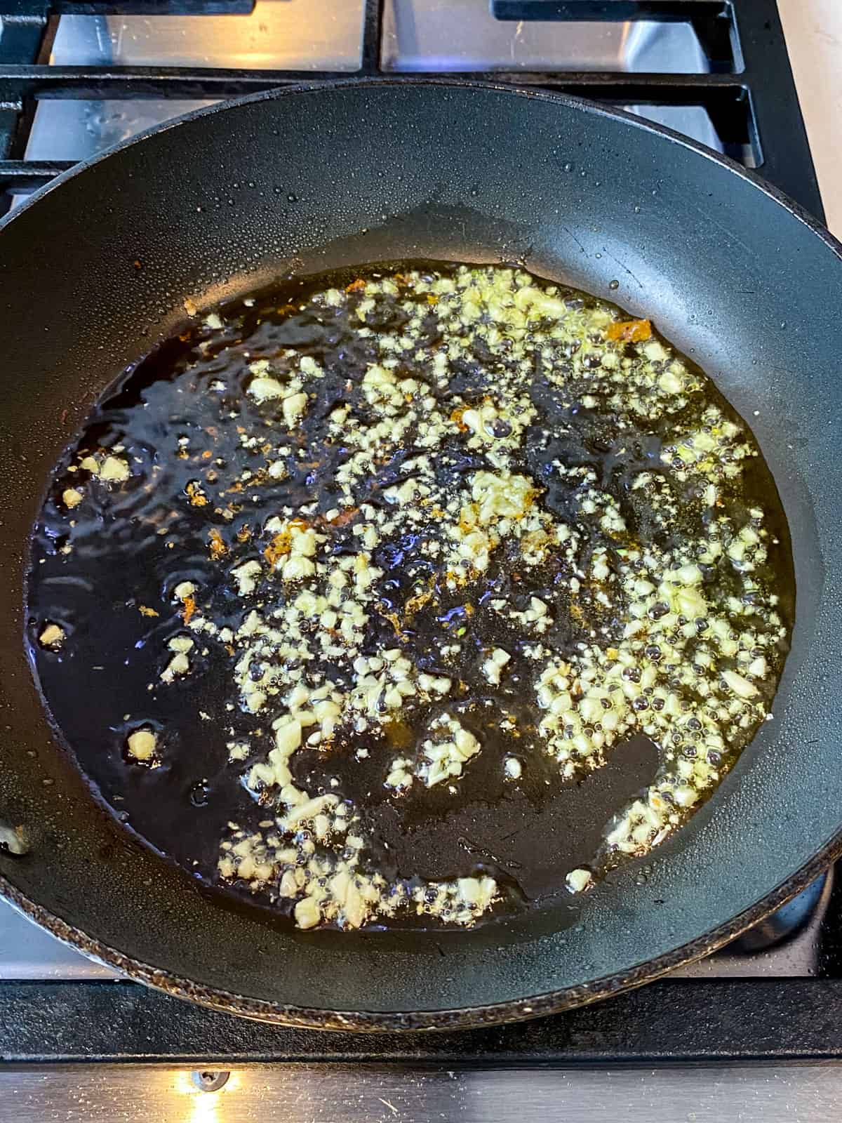 Saute chopped garlic in olive oil until lightly golden.