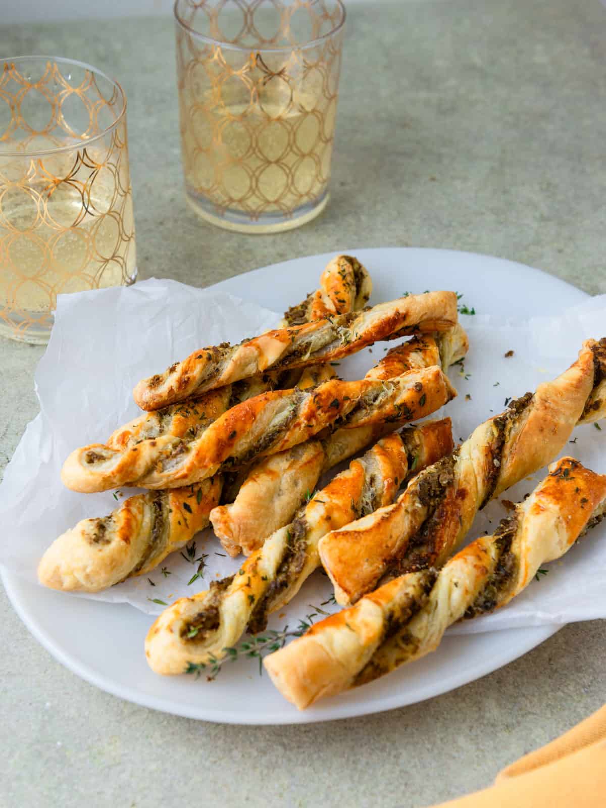 Olive puff pastry twists with cheese.