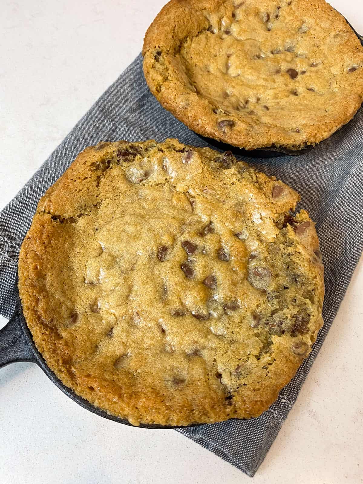 Bake the skillet cookie until golden brown and slightly gooey in the center.