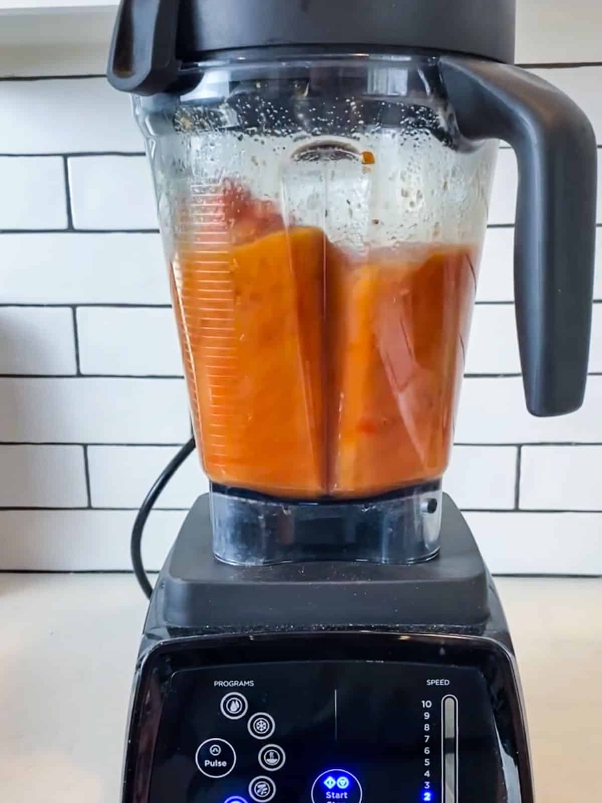 Blend the roasted tomato soup in a blender until smooth.