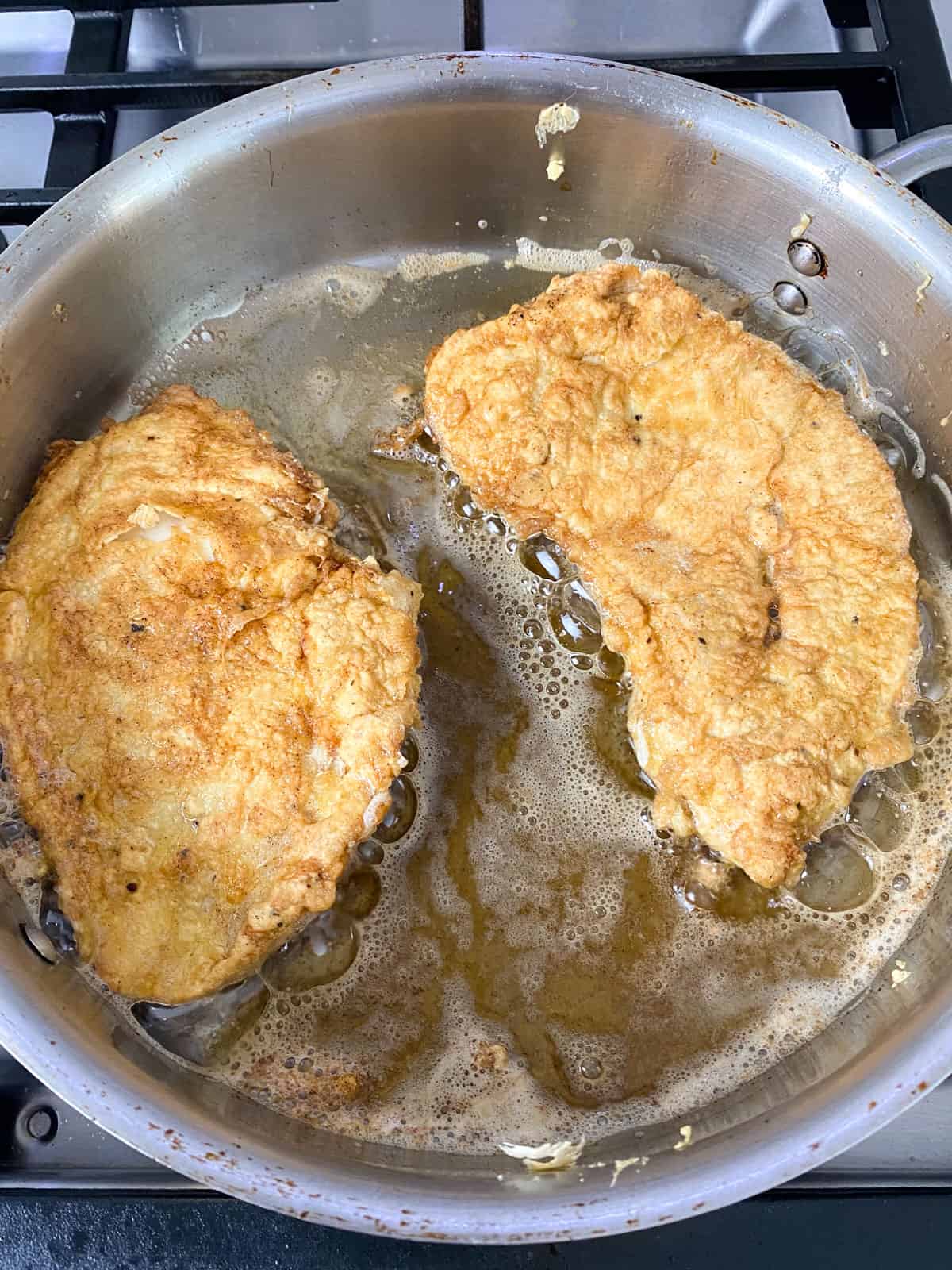 Cook the chicken cutlets on both sides until golden brown and cooked through.