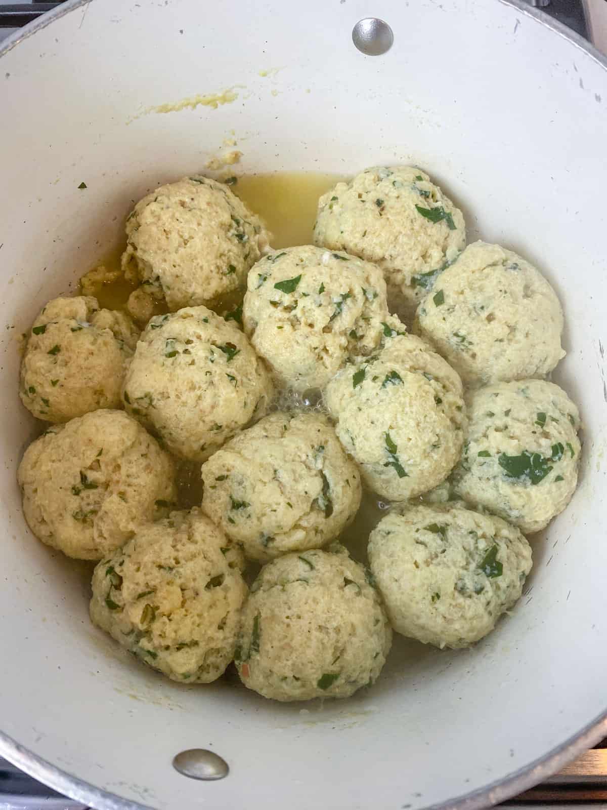 Cook the matzo balls in boiling water until plump.