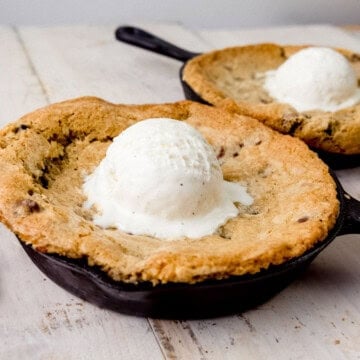 Chocolate chip pizookie served with vanilla ice cream on top.