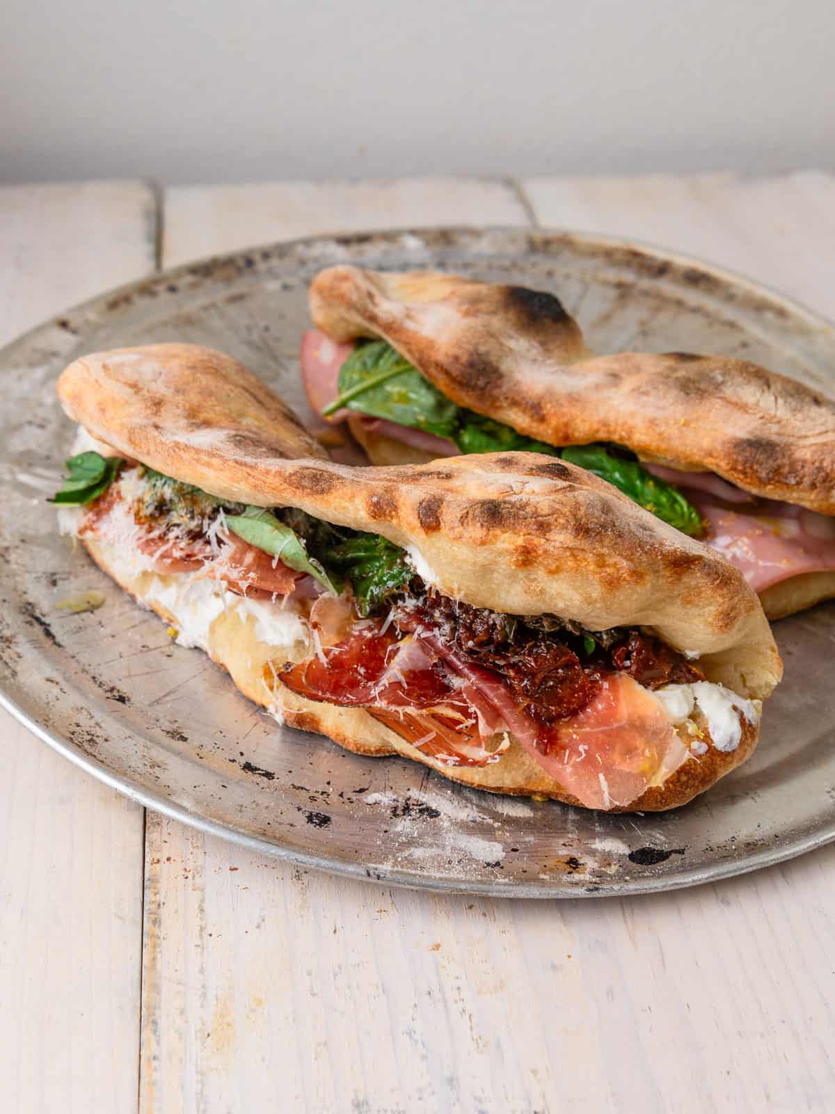 Pizza sandwich stuffed with creamy ricotta cheese, prosciutto and sundried tomatoes.