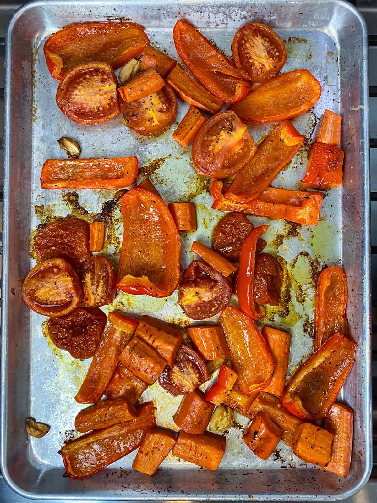 Roast the tomatoes and peppers until tender and cooked through.