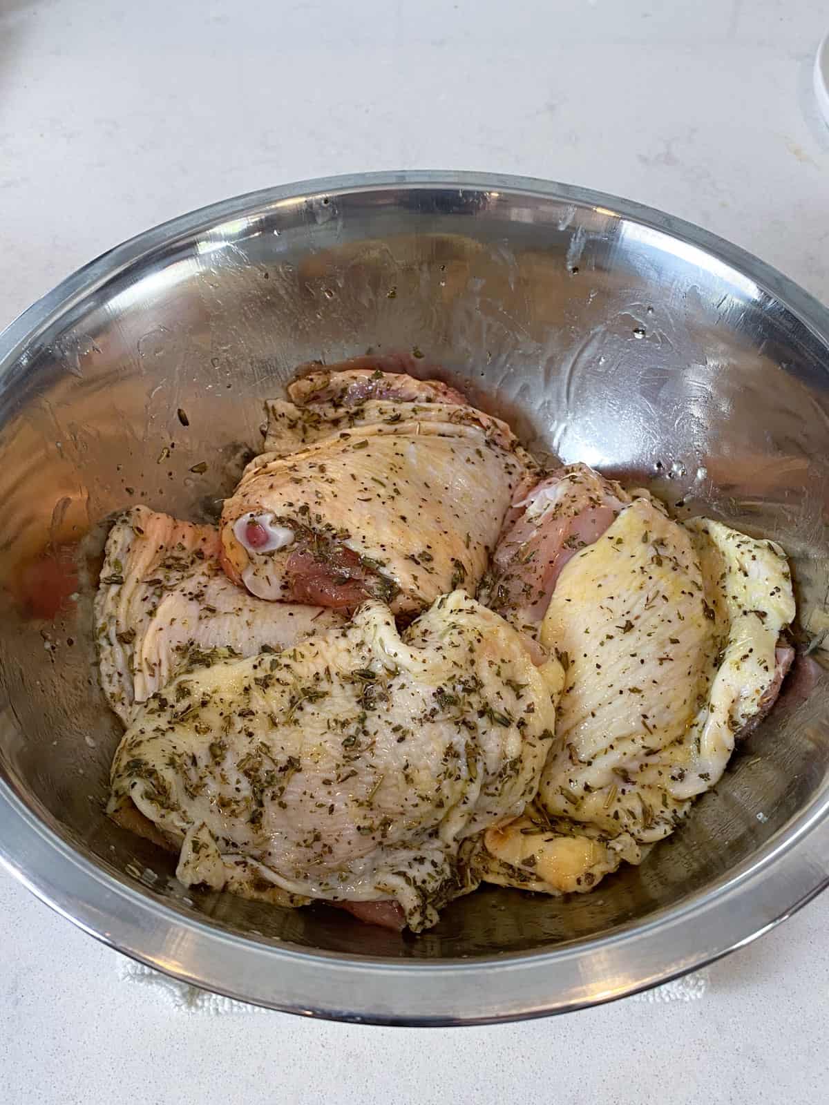 Season the chicken herbes de Provence and olive oil and rub all over.