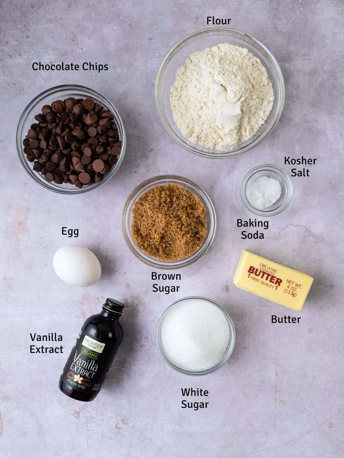Ingredients for skillet chocolate chip cookie including brown sugar, vanilla extract and chocolate chips.