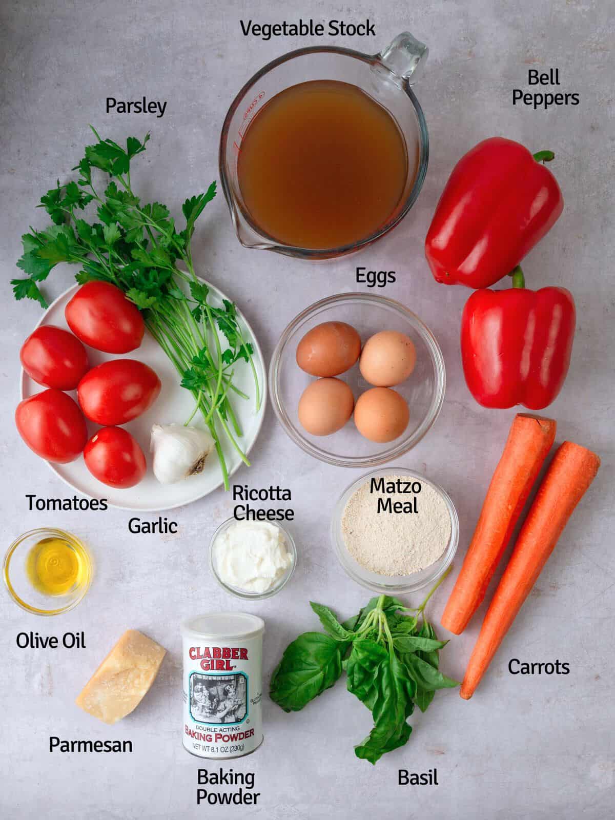 Ingredients for roasted tomato soup with matzo balls, including matzo meal, ricotta cheese, vegetables and stock.