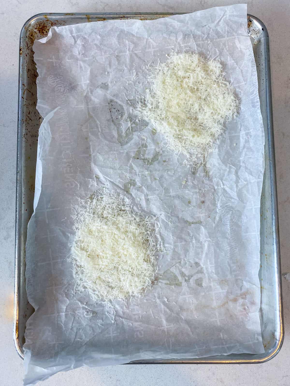 Form the grated Parmesan into a uniform circle on a lined baking sheet.