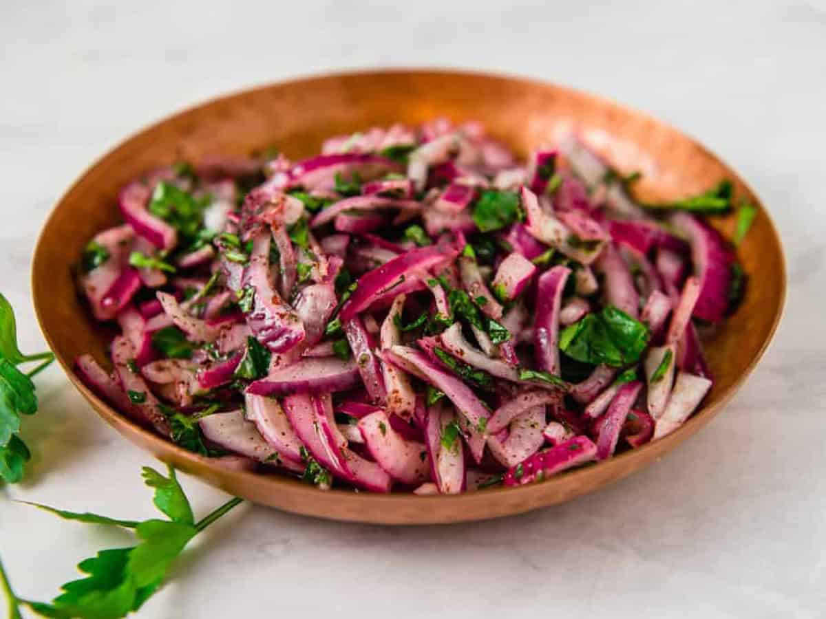 Turkish sumac onion salad with fresh parsley, lemon juice and olive oil.