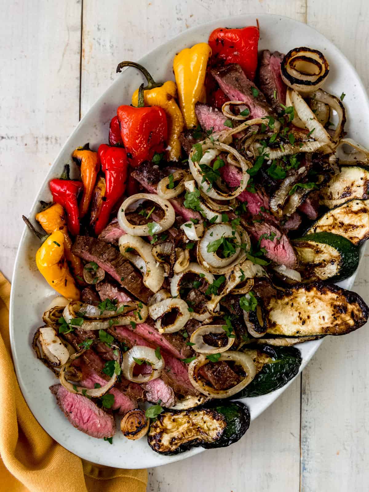 Grilled flank steak with grilled vegetables.