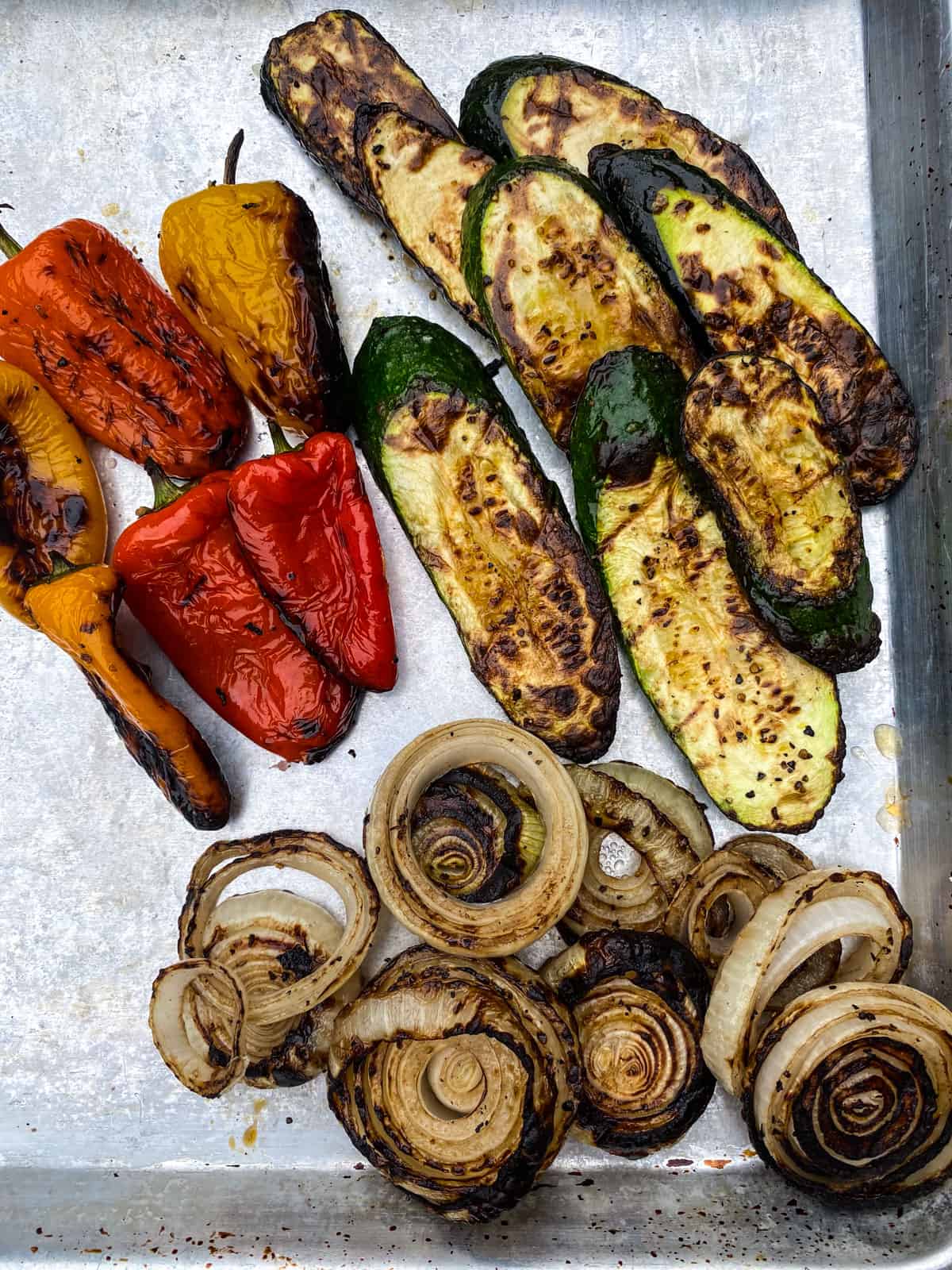 Grill the vegetables ontul charred and tender.