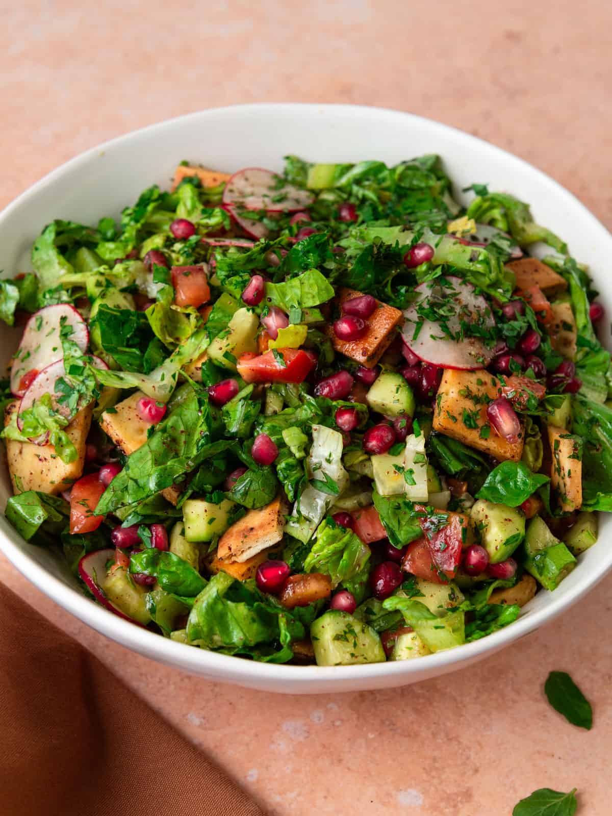 Fattoush salad recipe with pita chips and pomegranate molasses.