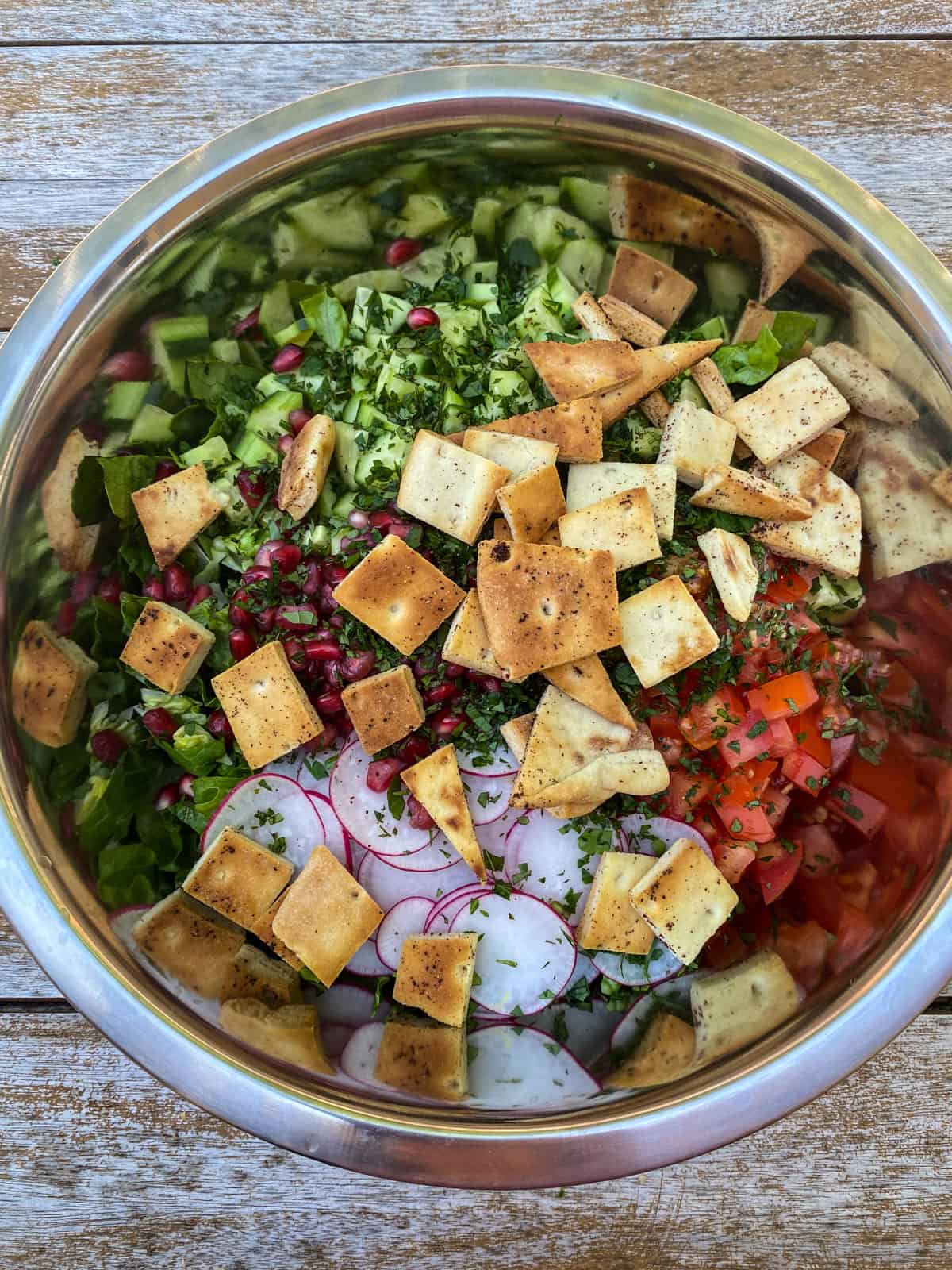 Add toasted pita chips to the fattoush salad.