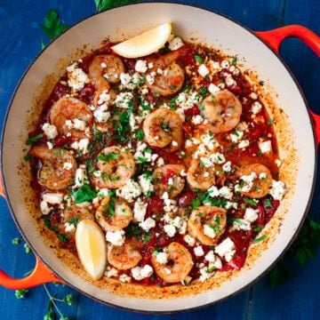 Greek shrimp saganaki recipe with feta in a rich tomato sauce.