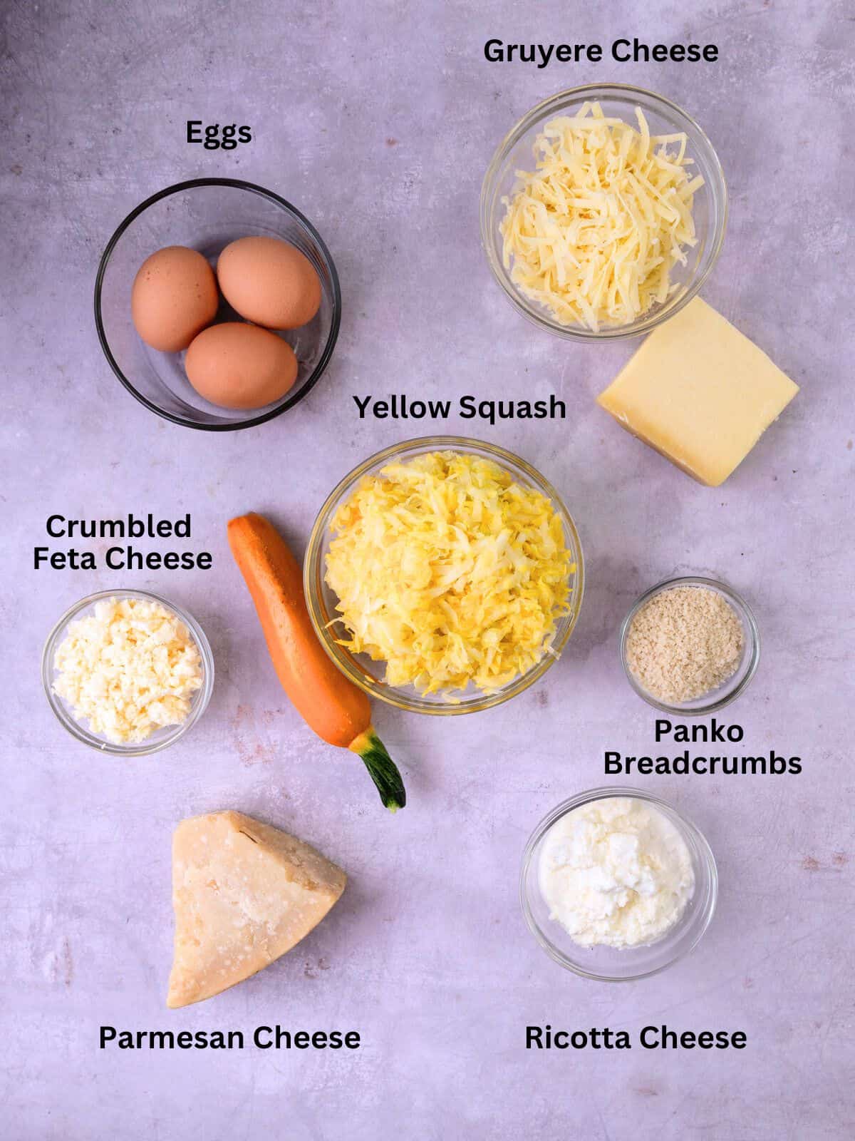 Ingredients for squash pie including Parmesan cheese, eggs, ricotta and panko breadcrumbs.