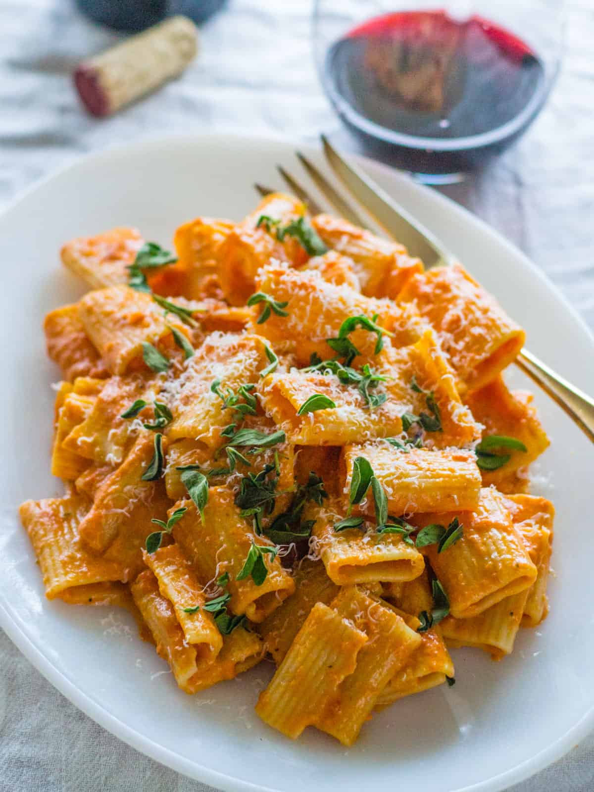 Pink vodka sauce with rigatoni and paired with red wine.