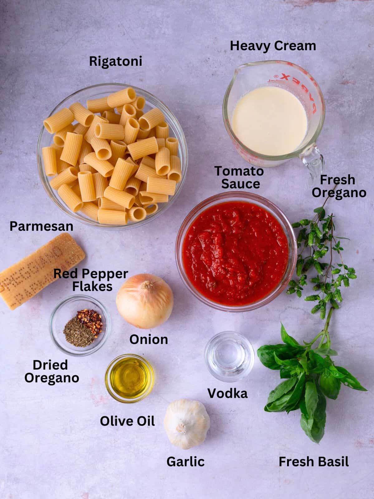 Ingredients for vodka pink sauce including heavy cream, garlic and Parmesan cheese.