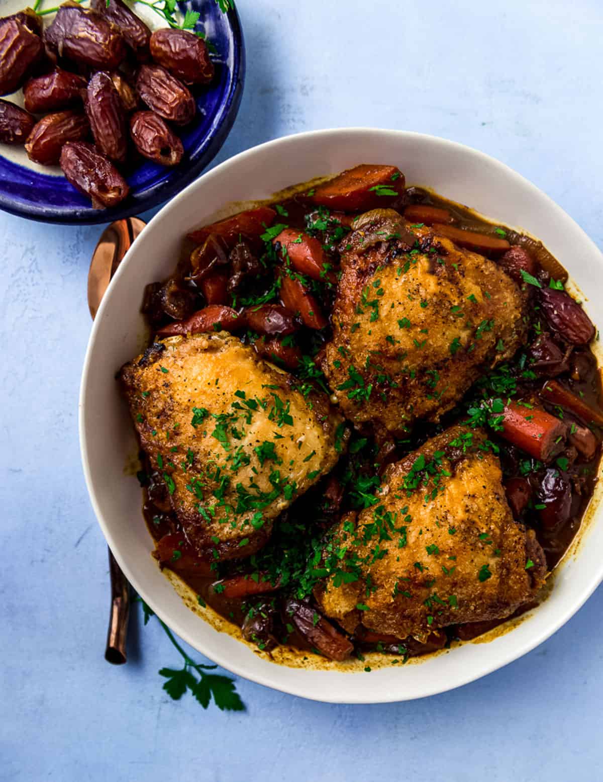 Braised chicken with red wine, dates and Mediterranean spices including saffron, turmeric and cumin.