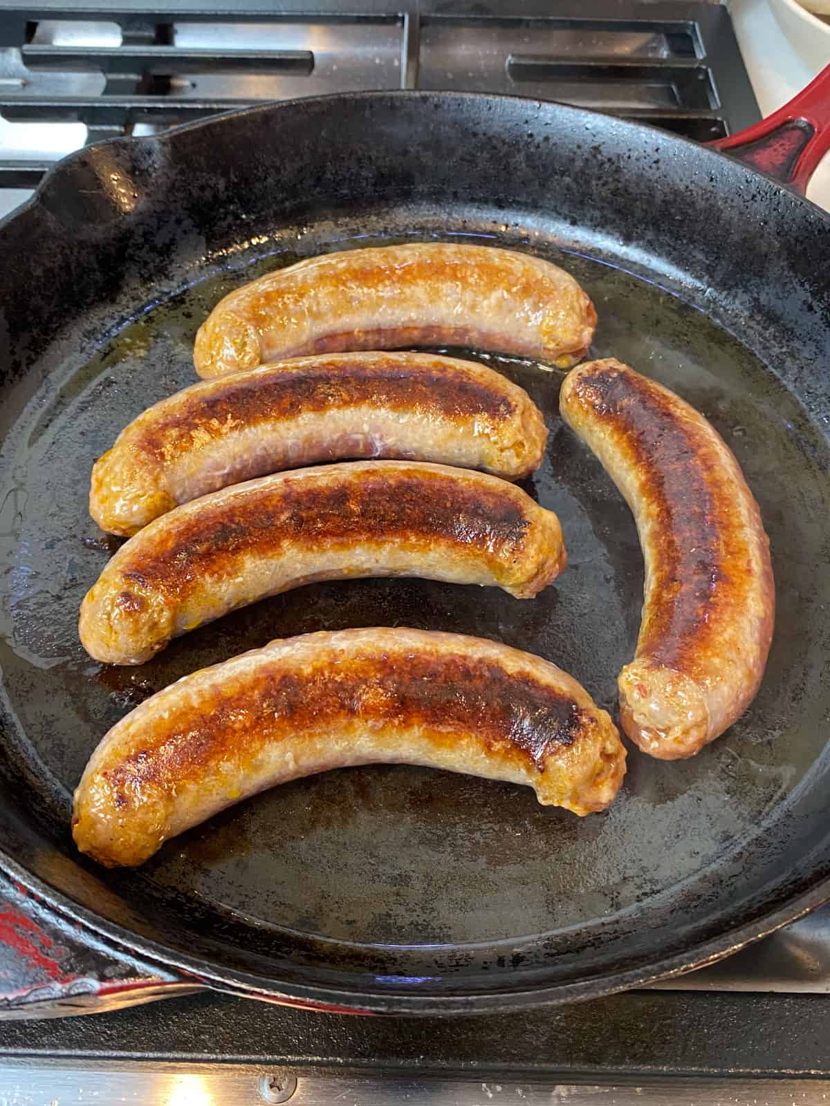 Sear the Italian sausage links until deeply charred on both sides.