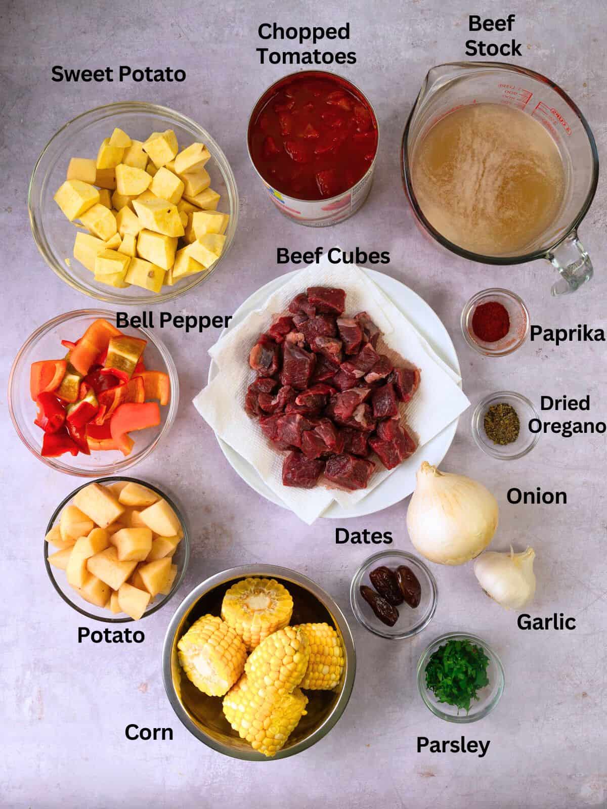 Ingredients for Argentinian beef stew, including corn, sweet potatoes and spices.