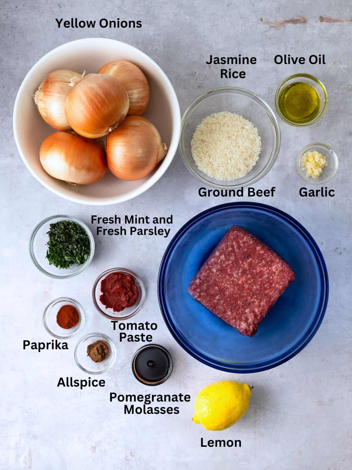 Ingredients for Turkish stuffed onions, including ground beef, tomato paste, herbs and spices.