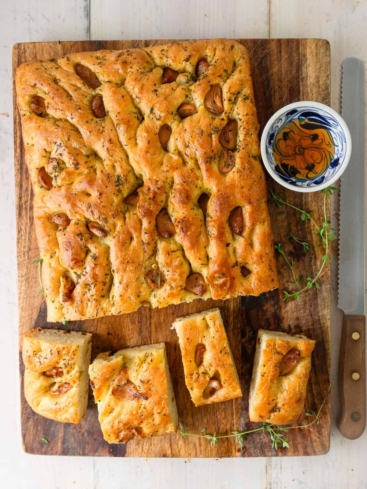 Garlic focaccia bread with herbs and brushed with honey garlic glaze.