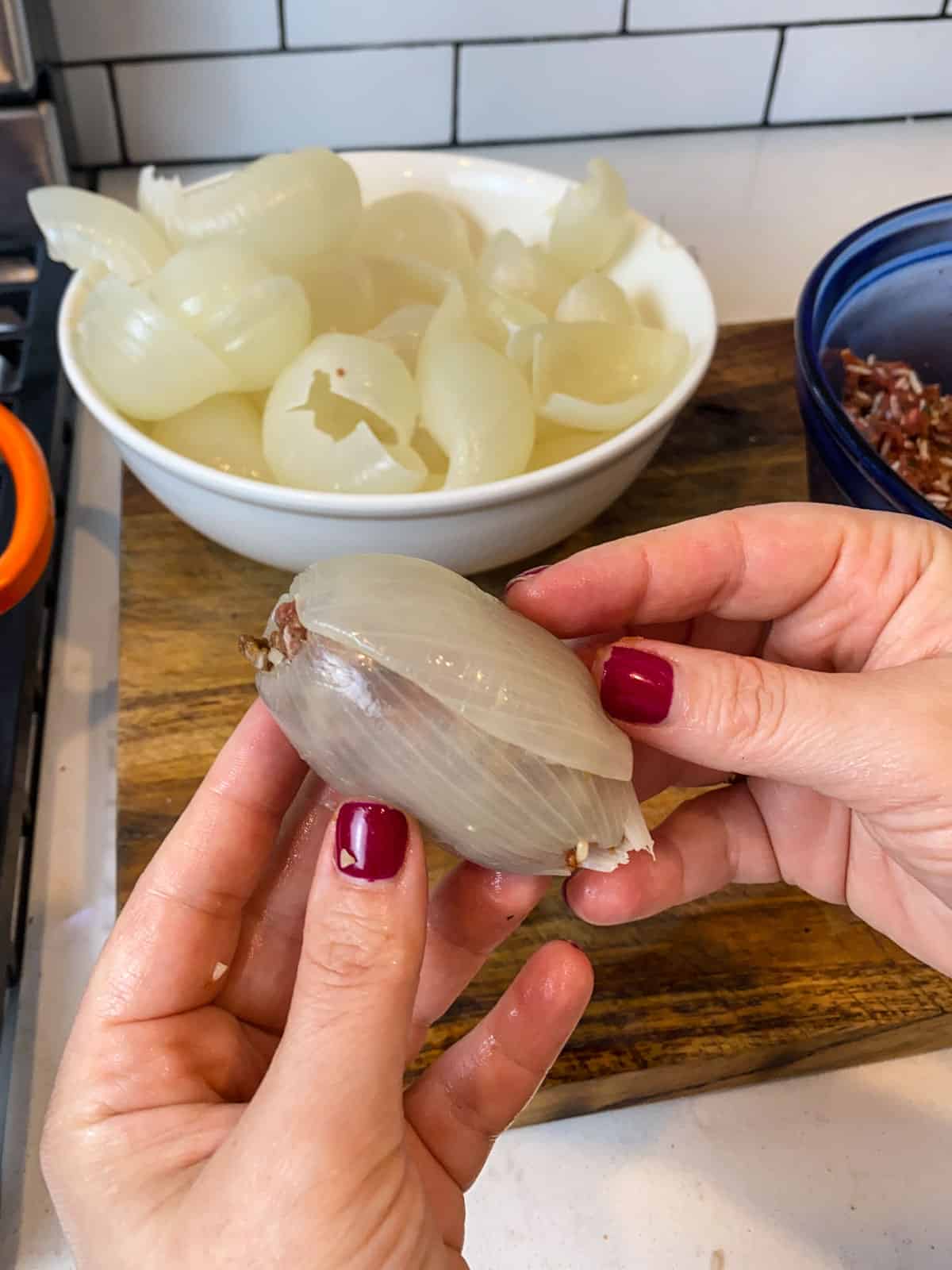 Roll up the stuffed onion, encasing the meat mixture in the onion layer.