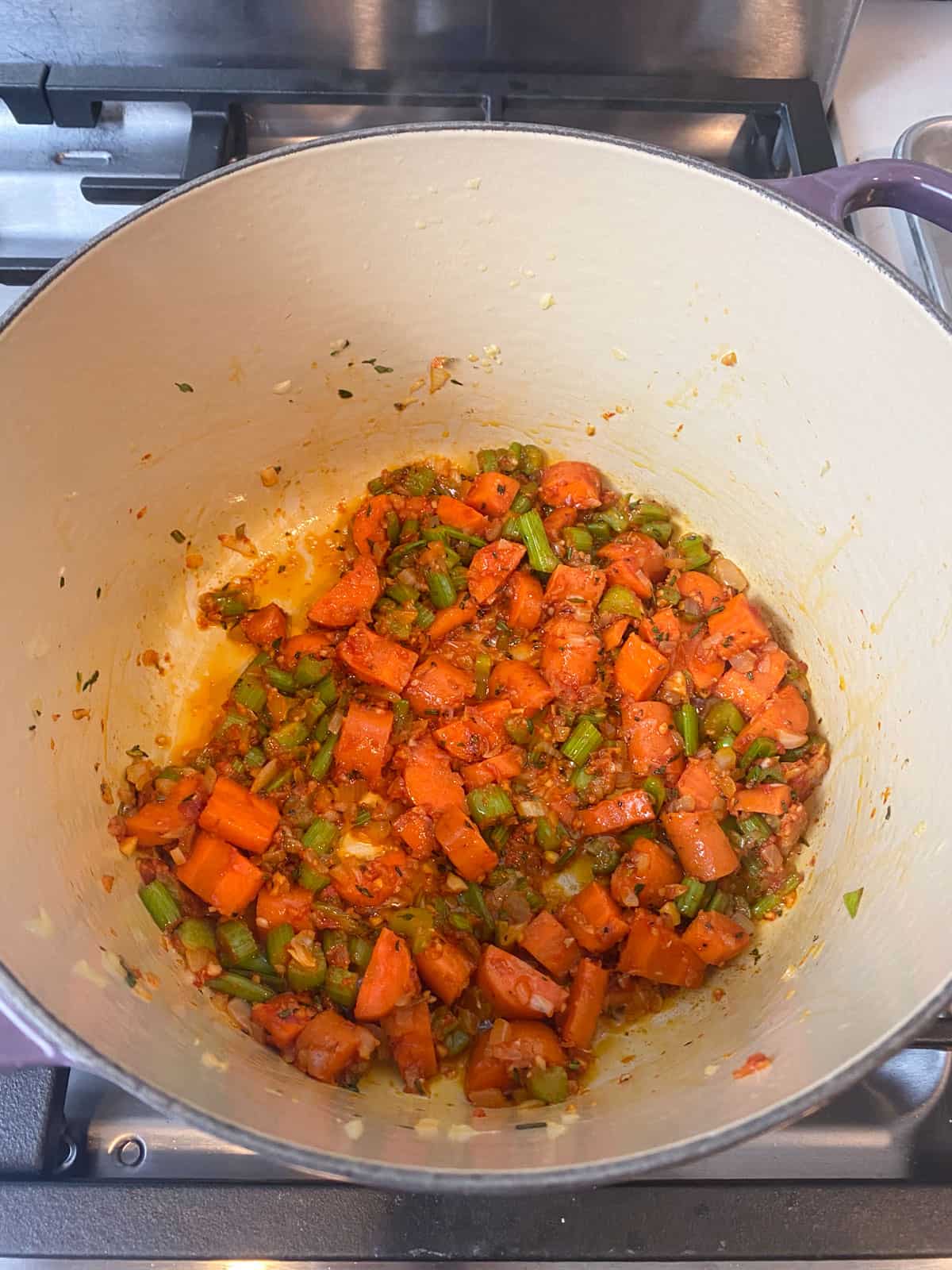 Saute tomato paste with the sauteed vegetables.