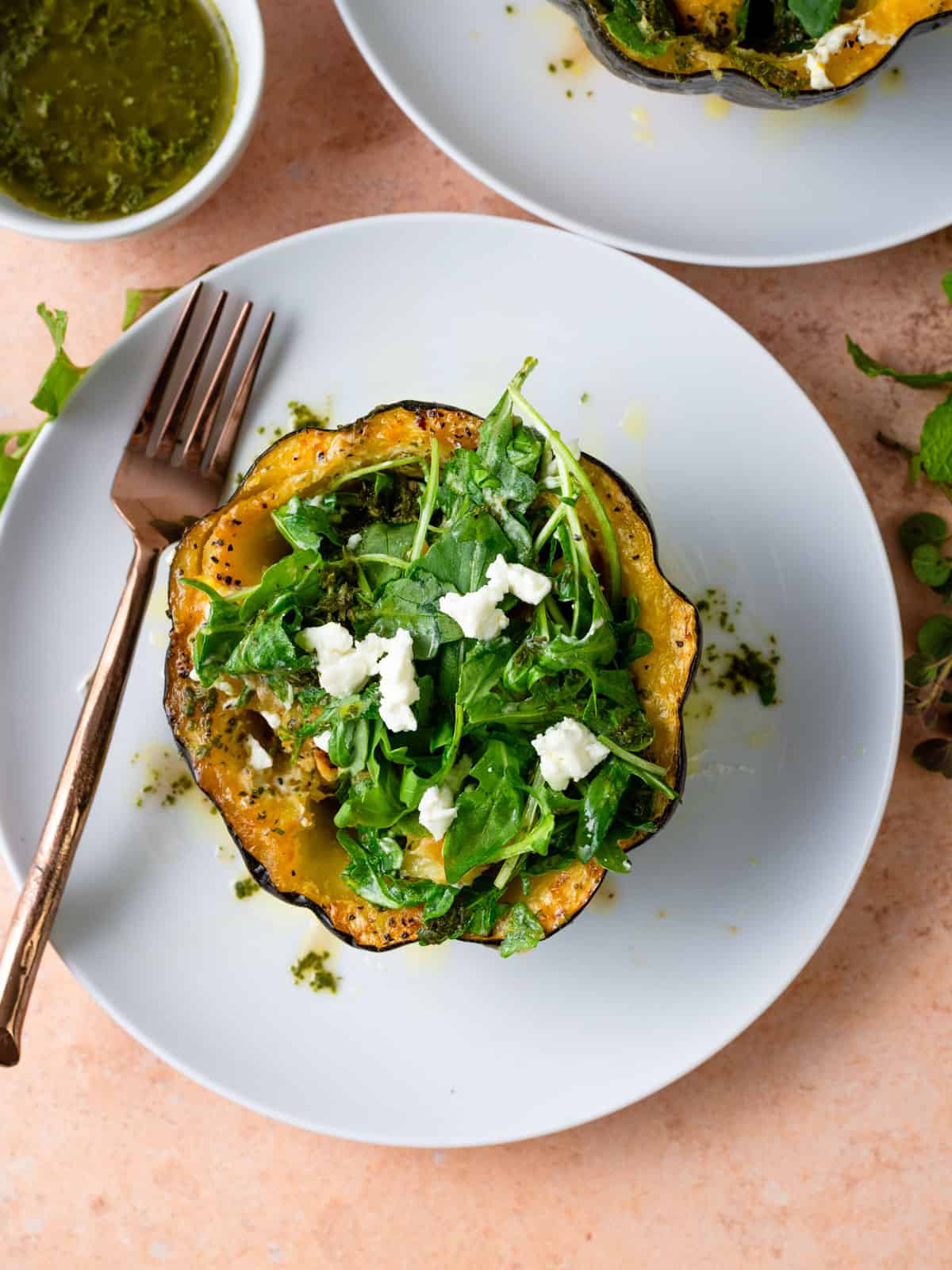 Roasted acorn squash stuffed with arugula and goat cheese.