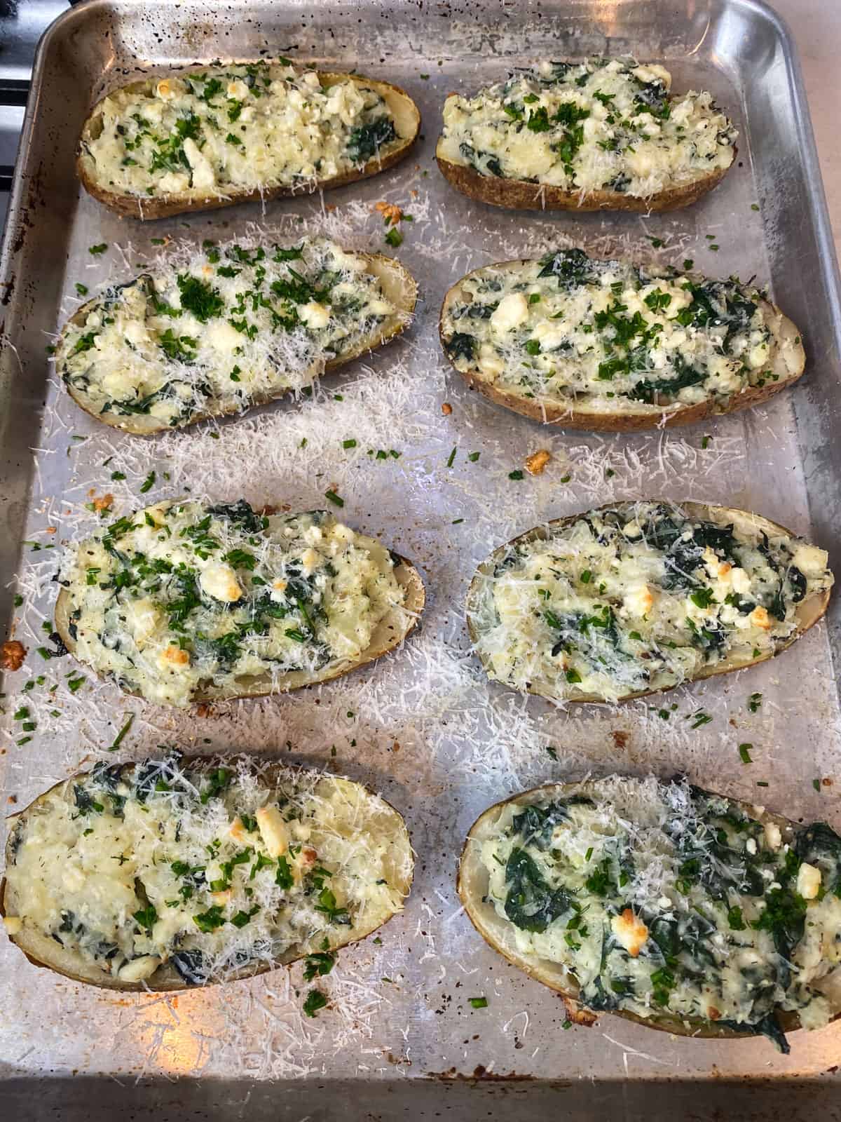 Bake the spinach and feta baked potatoes until lightly golden on top.