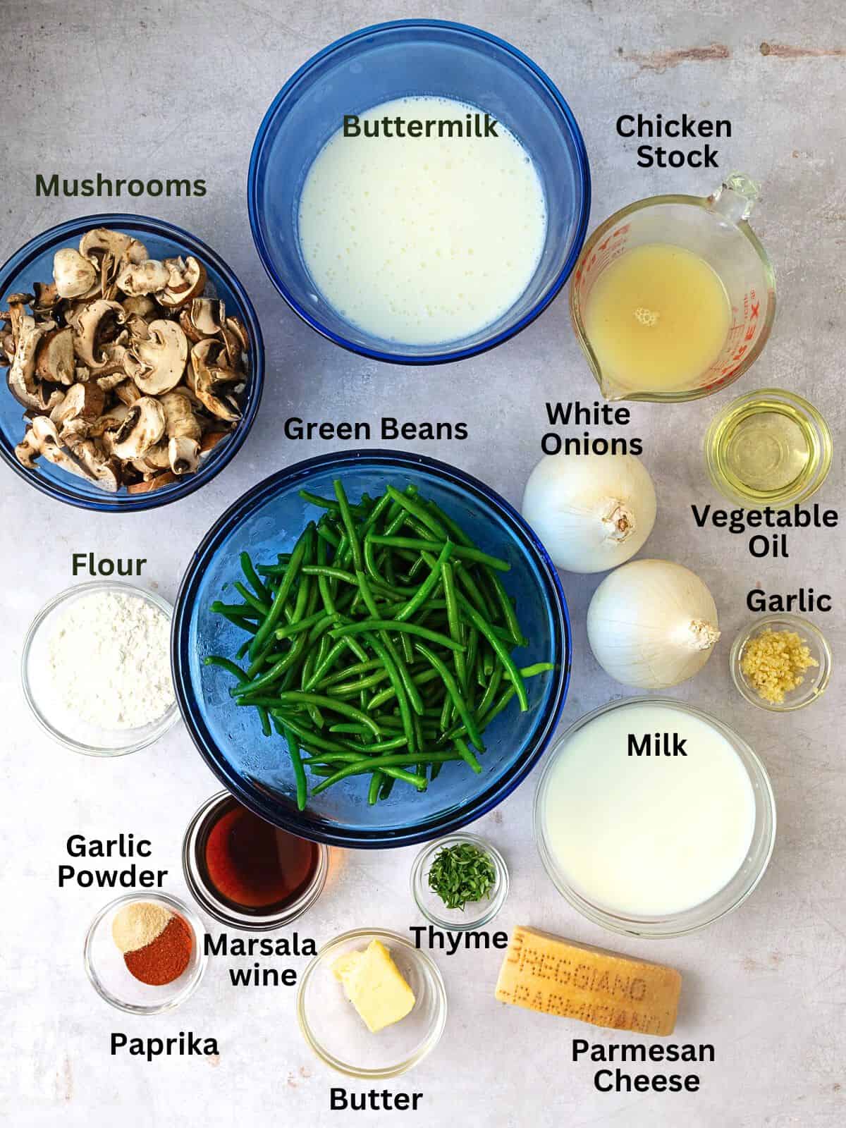 Ingredients for homemade green bean casserole, including mushrooms, buttermilk, spices and onions.