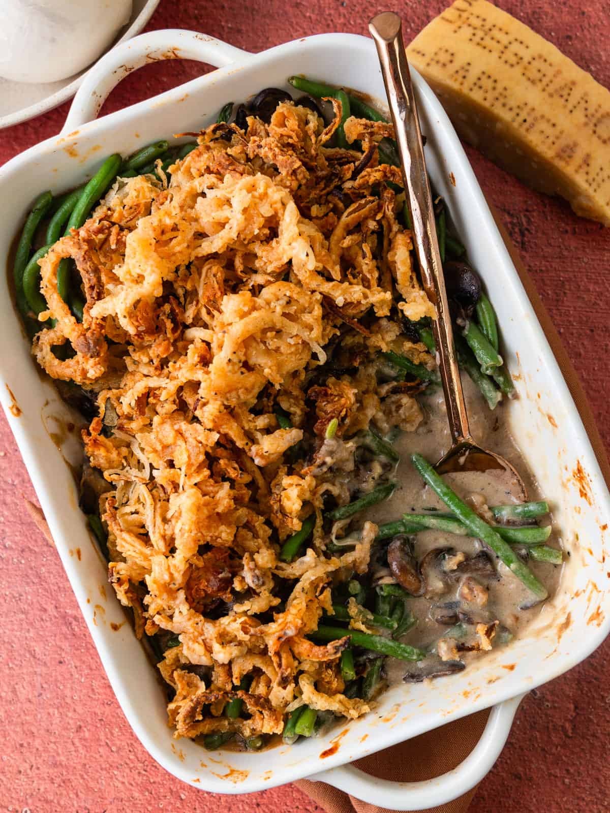 Creamy green bean casserole topped with fried onions.