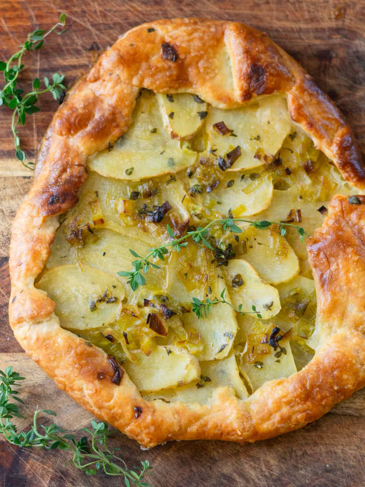 Savory leek and potato tart with fresh thyme.
