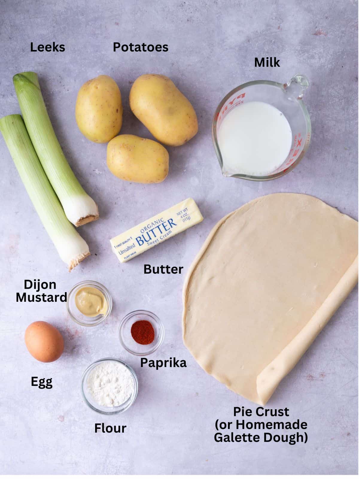 Ingredients for potato leek tart including milk, leeks and paprika.