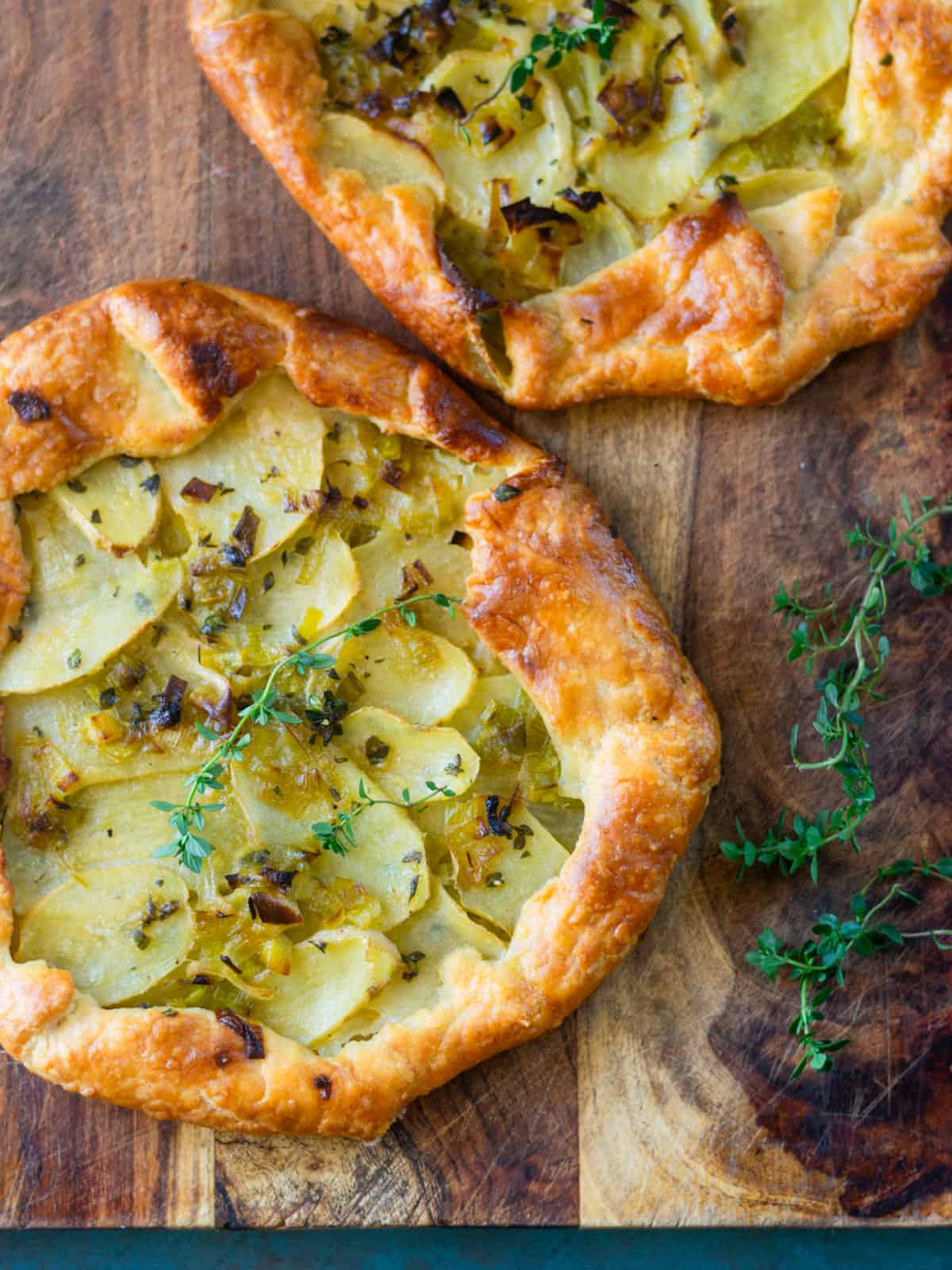 Potato leek tart topped with fresh thyme.