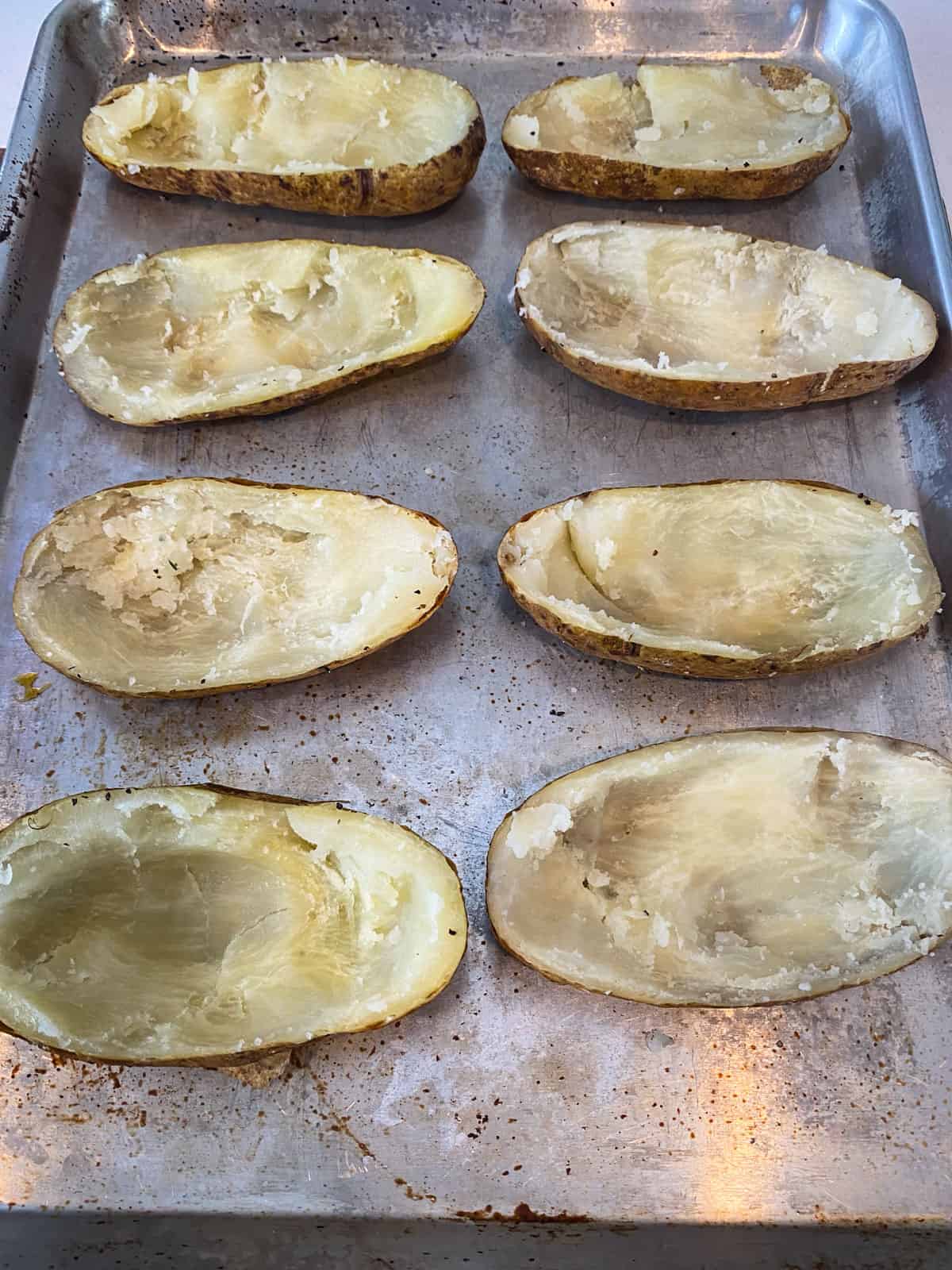 Scoop out the soft potato center, leaving a border around the potato skins.