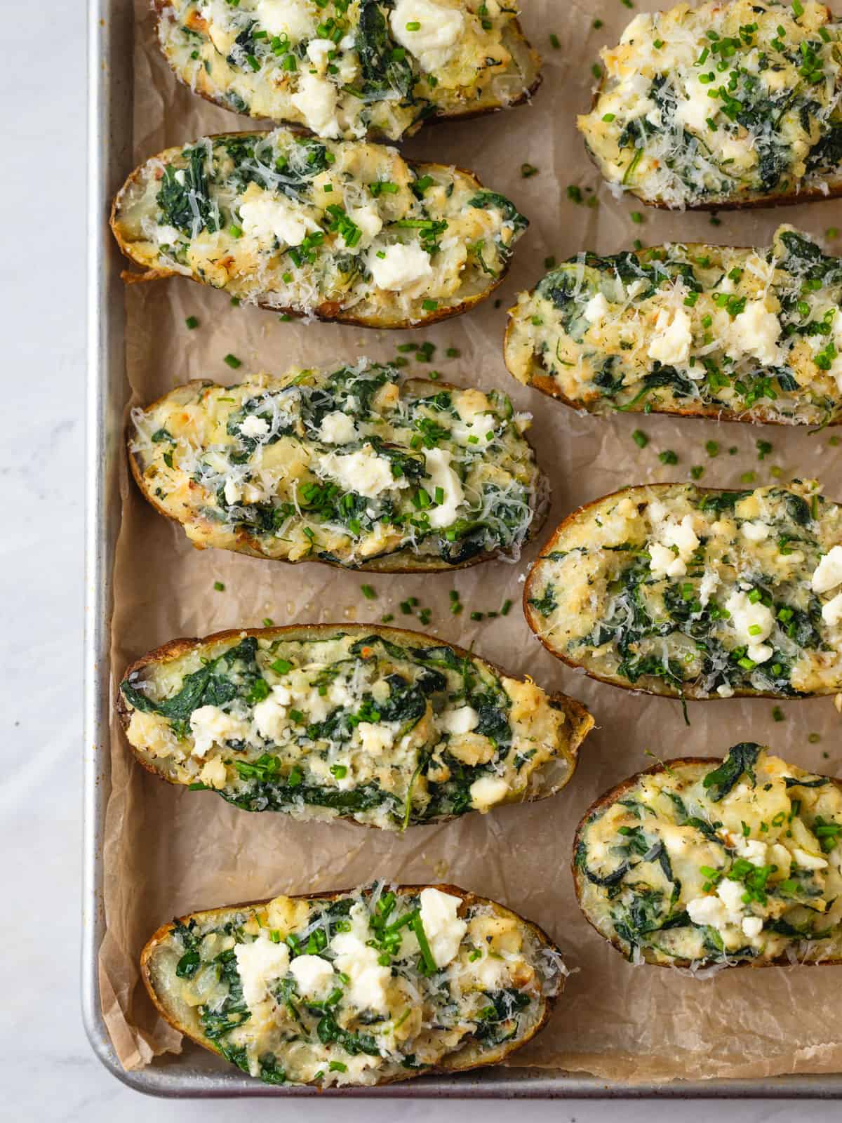 spanakopita baked potatoes stuffed with spinach, sauteed shallots and garlic and feta cheese.