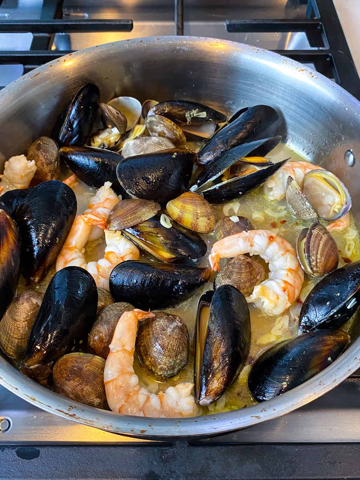 Add the shrimp to the mussels and clams.