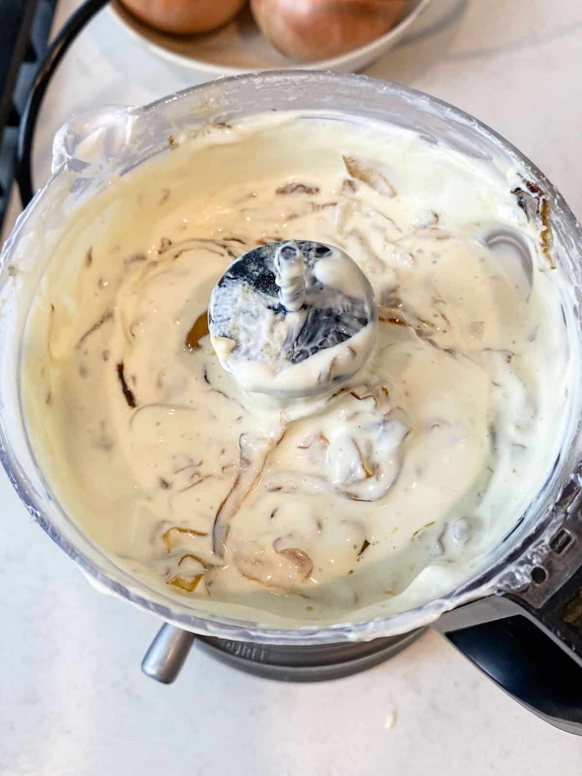 Add the caramelized onions to the sour cream and cream cheese mixture and pulse to combine.