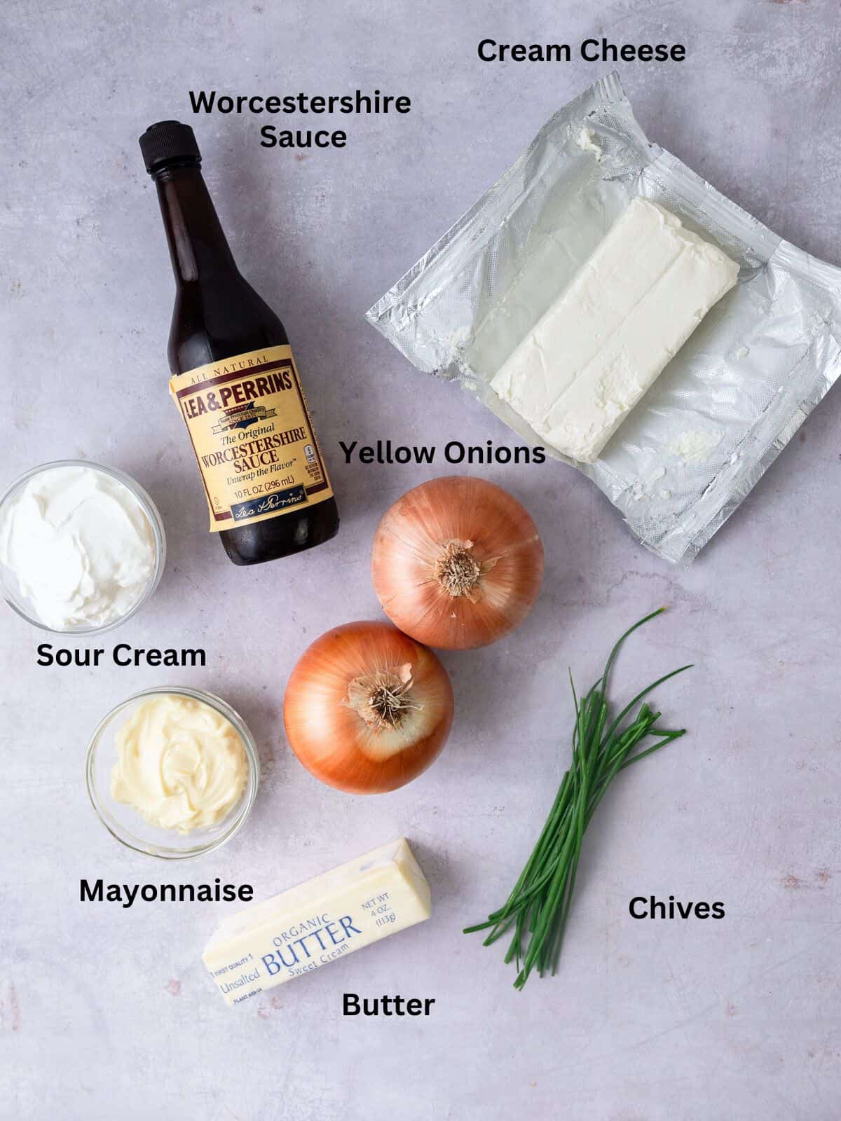 Ingredients for caramelized onion dip, including yellow onions, cream cheese, sour cream and Worcestershire sauce.