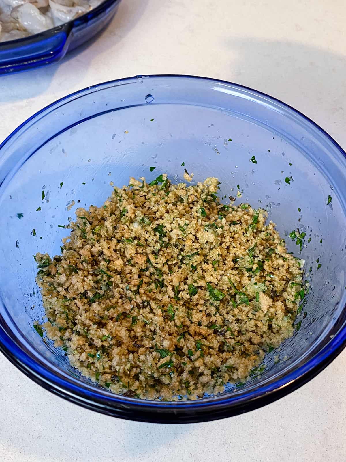 Mix the herbs, grated Parmesan cheese and olive oil with the panko breadcrumbs.